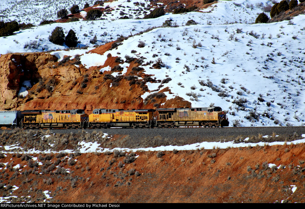 UP 5282, 6420, 2573 (C45ACCTE, C44AC, ET44AH)lead an eastbound empty hopper train [a monster] at Castle Rock, Utah. February 19, 2022 {Winter Echofest}